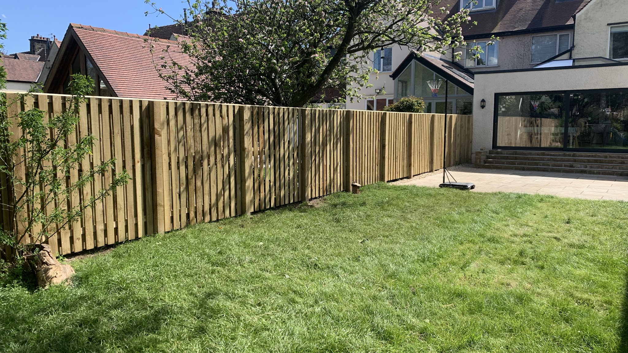 A completed timber fence wrapping around an Ilkley garden